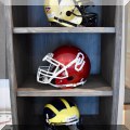 C04. College football helmets. 